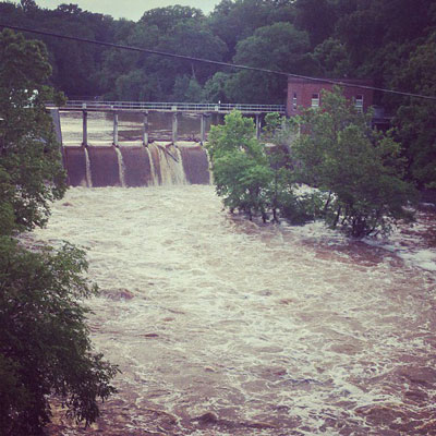 Water was seen rushing over the Lake Jackson Dam on Monday afternoon after heavy rains inundated the region. [Photo: John-Paul Zajackowski]