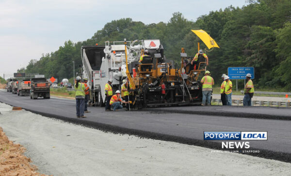 Now at the height of construction, a paving crew working on the 95 Express Lanes at Quantico uses a GPS assisted paving machine to lay the first new layers of asphalt. [Photo: Uriah Kiser / Potomac Local News]