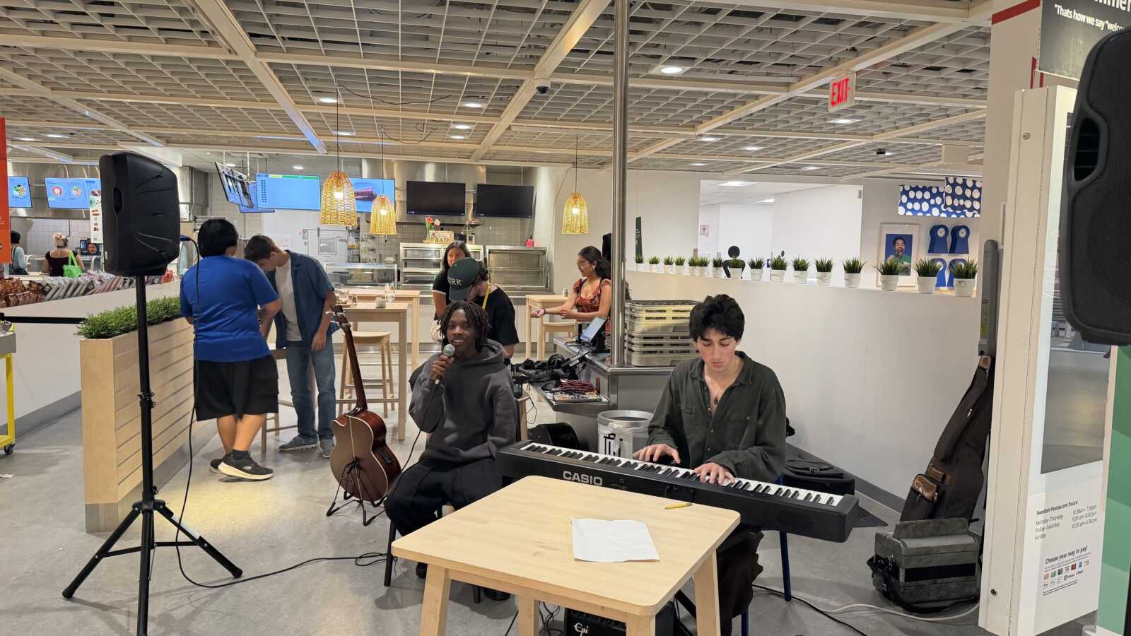 Students perform live music in the IKEA restaurant during the Communities for Youth night