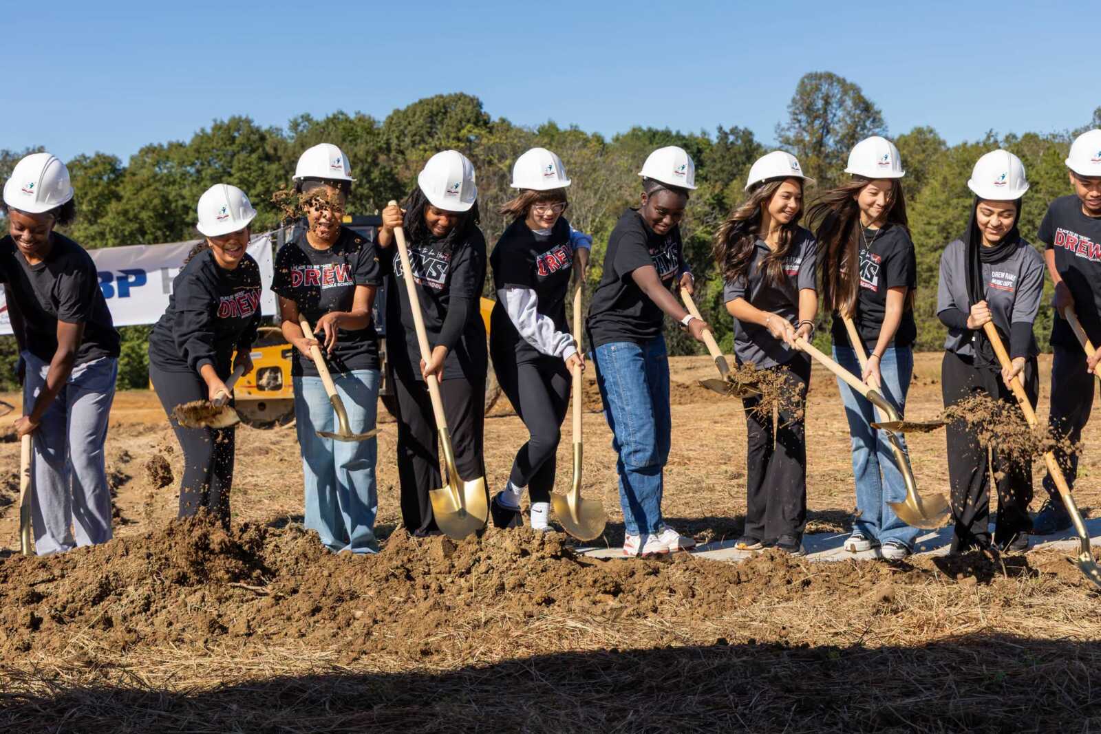 Students take part in the groundbreaking.