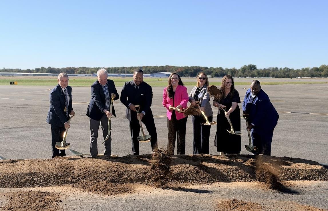 Officials turn dirt at the air traffic control tower groundbreaking at Washington Manassas Airport