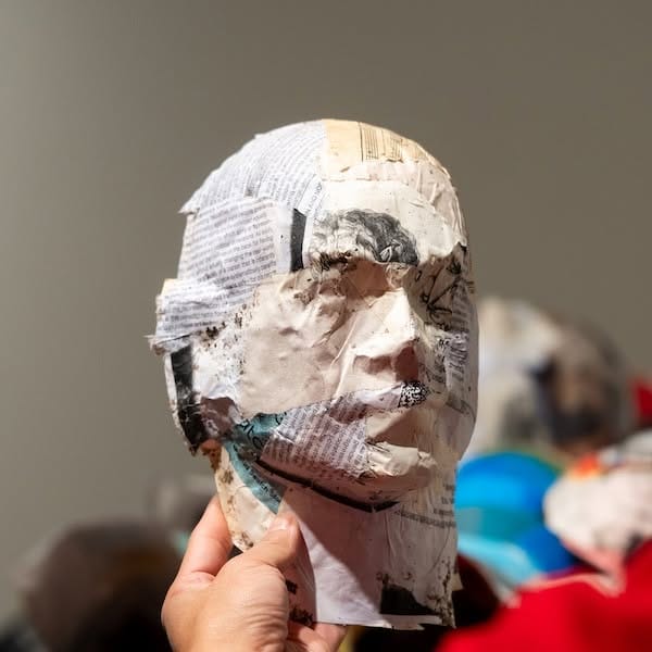 A decorated mask from a Hylton Performing Arts Center workshop