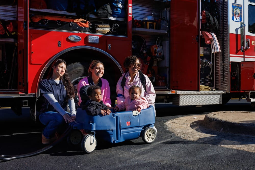Staff and children at CDC North pose for a photo with firefighters