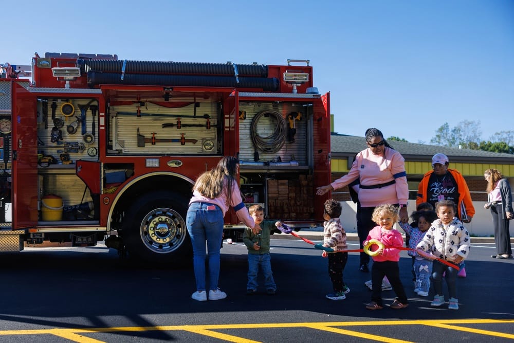 Children view a fire truck on display at CDC North