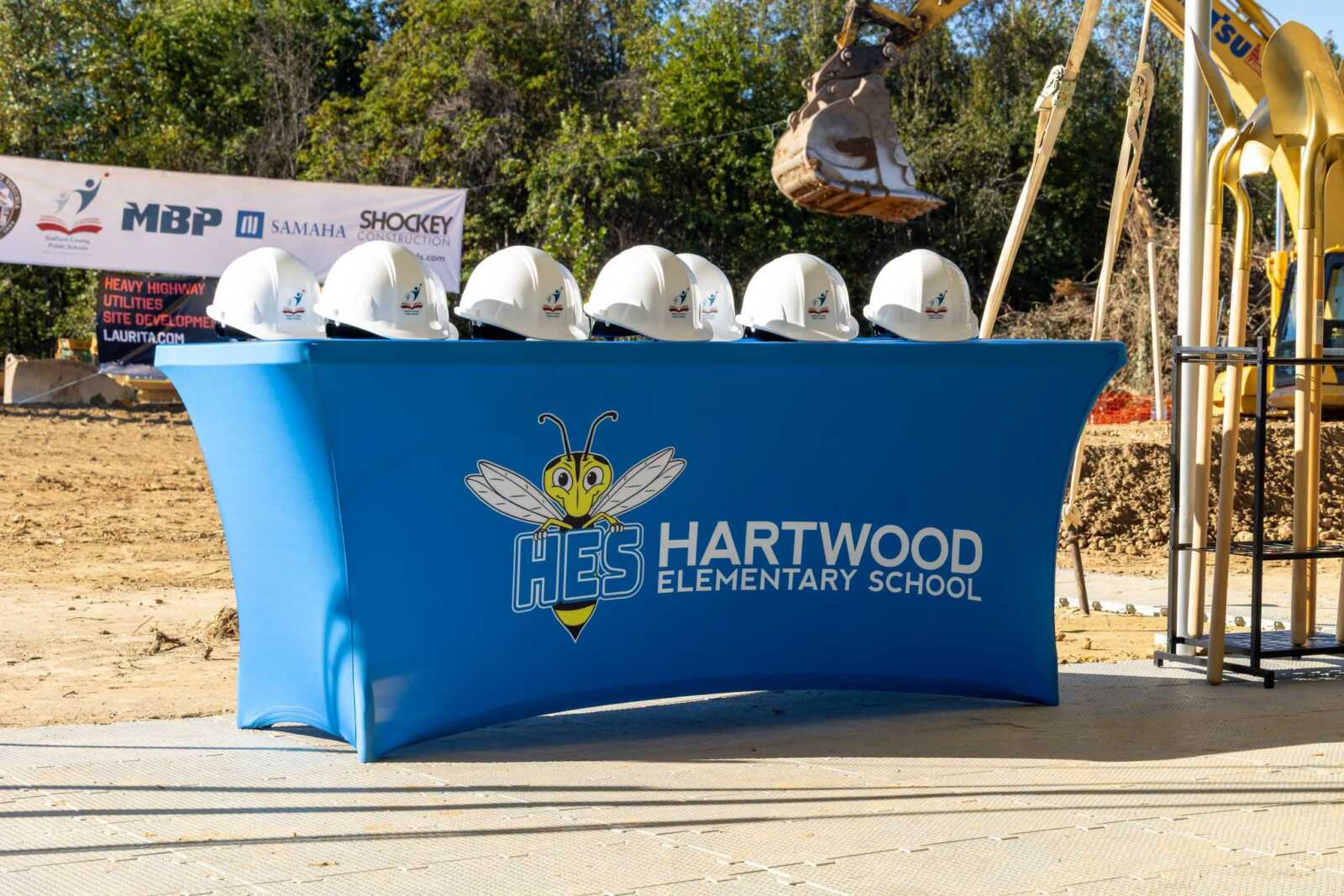 Hard hats on a Hartwood Elementary School table at the groundbreaking.